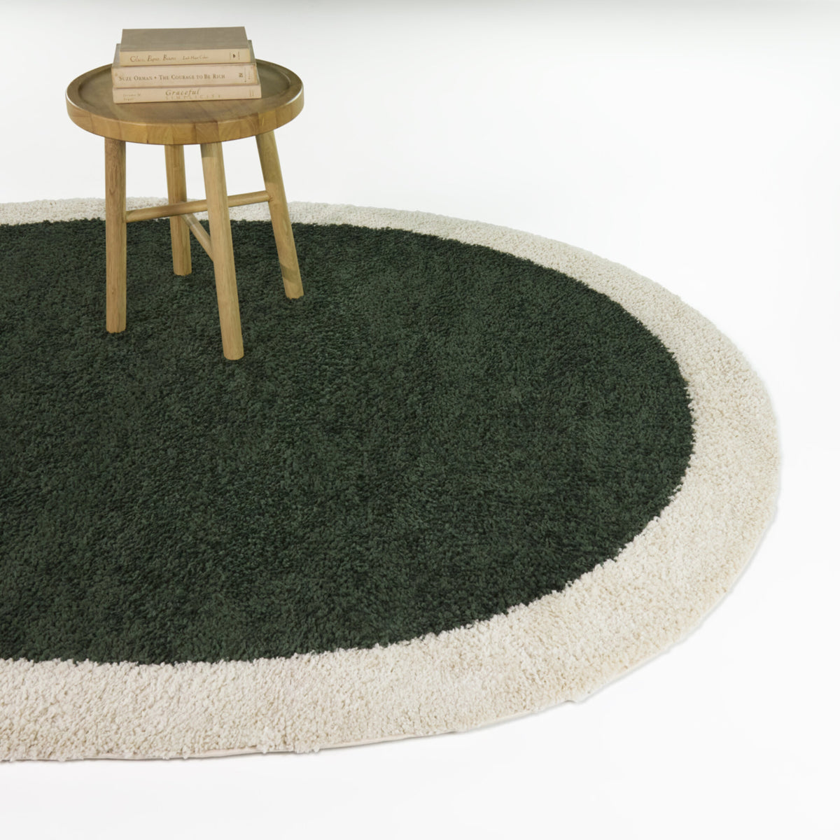 Odelle Solid Border Oval Area Rug