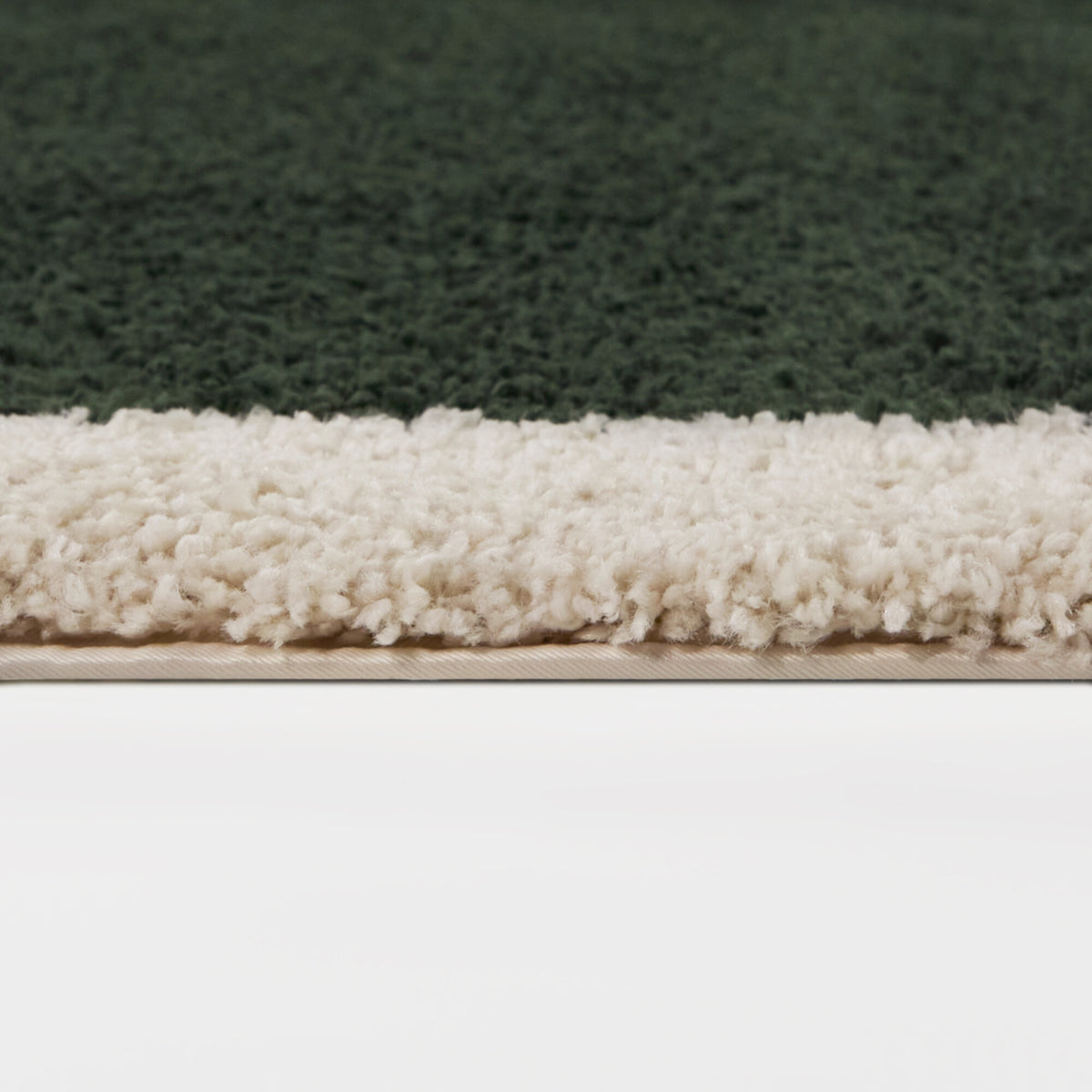 Odelle Solid Border Oval Area Rug