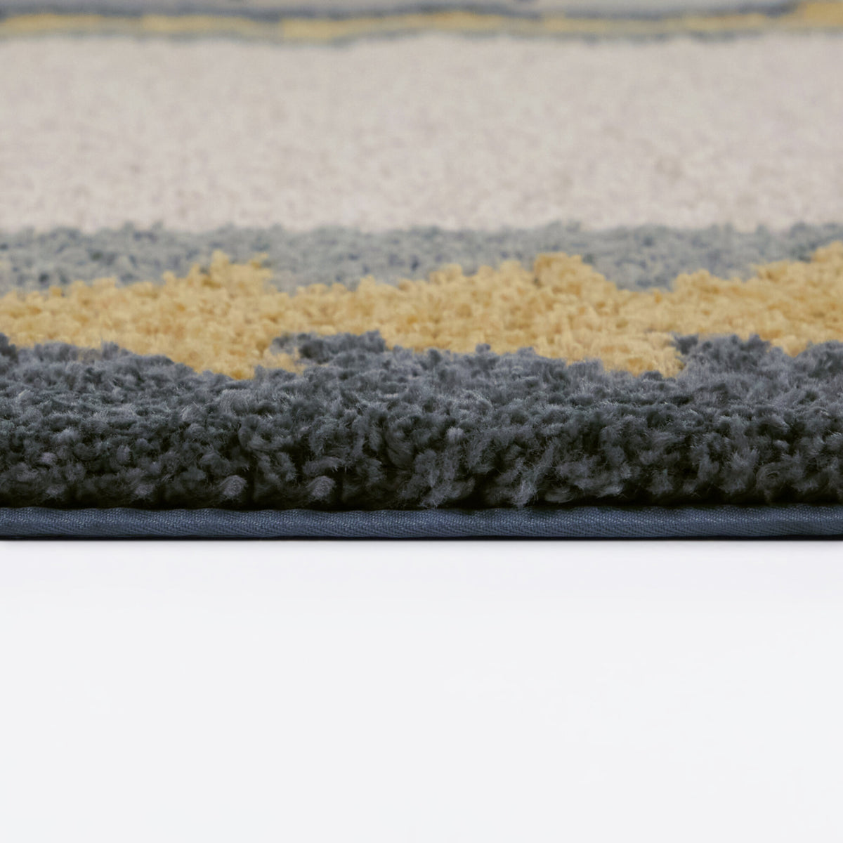 Kinnaird Triangular Border Area Rug